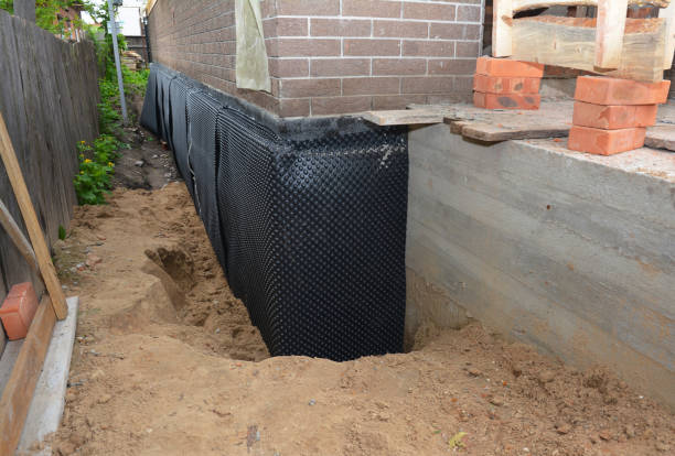 SJ Waterproofing Pros technician performing targeted Waterproofing assessment in Ooltewah, TN